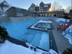 Condos Vacances MSA 2CH AVEC PISCINE ET SPAS EXTERIEURS GRATUITS 4 SAISONS!!